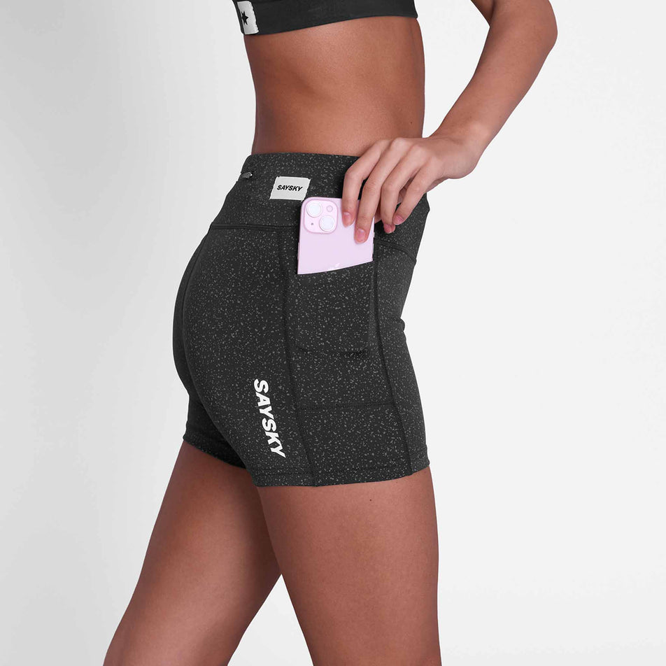 A model demonstrating the side stash pocket on the SAYSKY Women's Universe Combat+ Short Tights 4