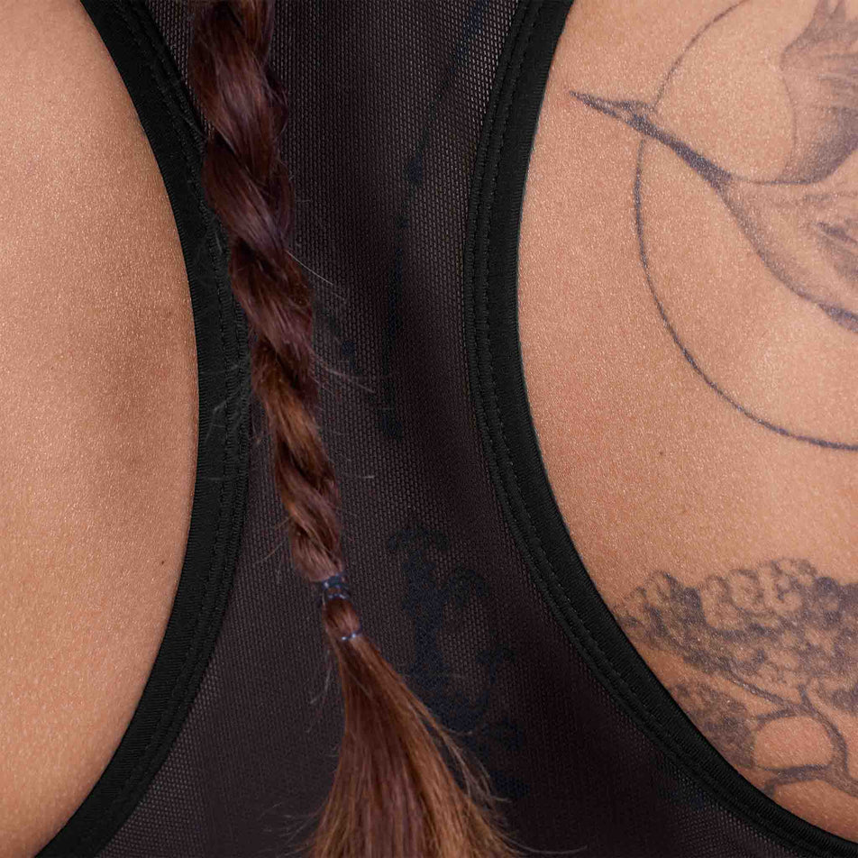 Back view of a model wearing the SAYSKY Women's Clean Combat Sports Bra in the Black colourway.