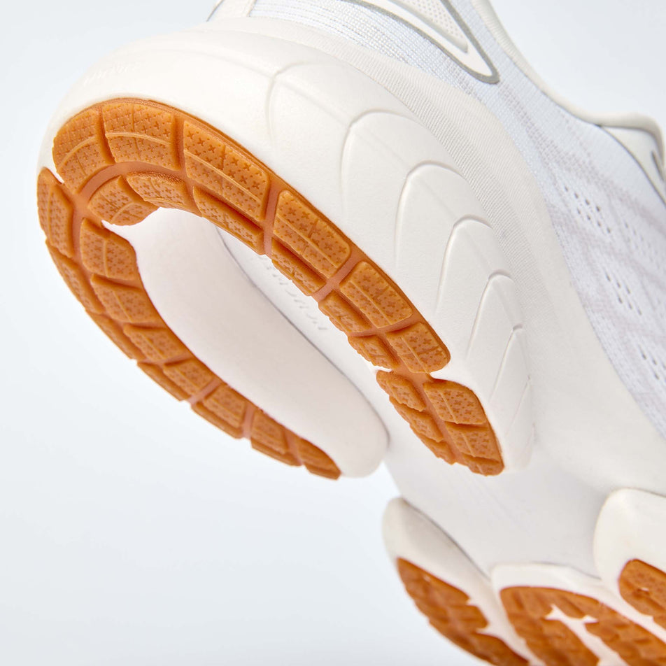 The rearfoot section of the right shoe from a pair of True Motion Men's U-Tech Nevos 4 Running Shoes in the White/Bright White colourway.