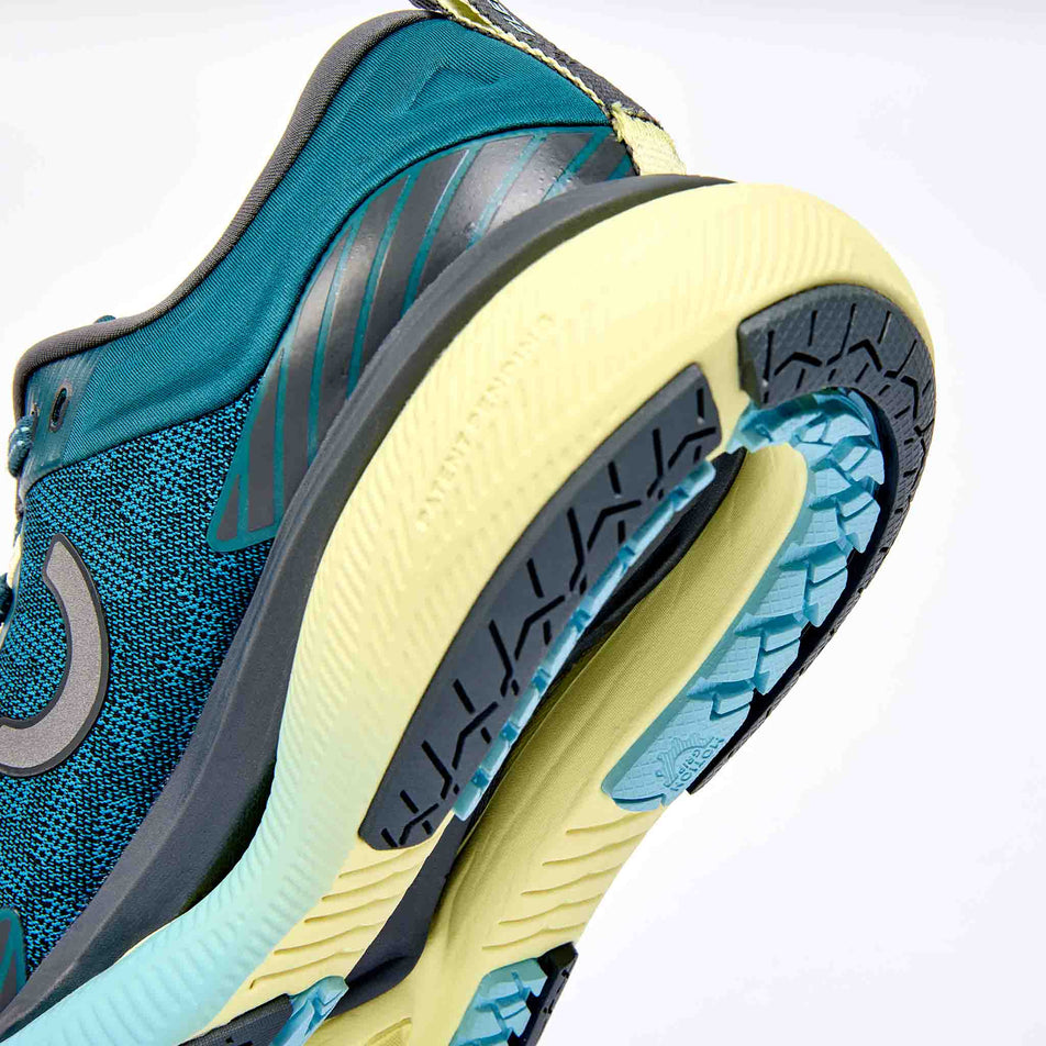 The rearfoot section of the right shoe from a pair of True Motion Women's U-Tech Aion Elements Running Shoes in the Mediterranea/Iron Gate Aquatic colourway.