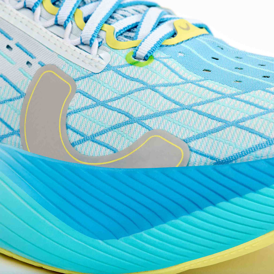 The toebox of the right shoe from a pair of True Motion Women's U-Tech Solo 2 Running Shoes in the White/Oyster Mushroom/Malibu Blue colourway.