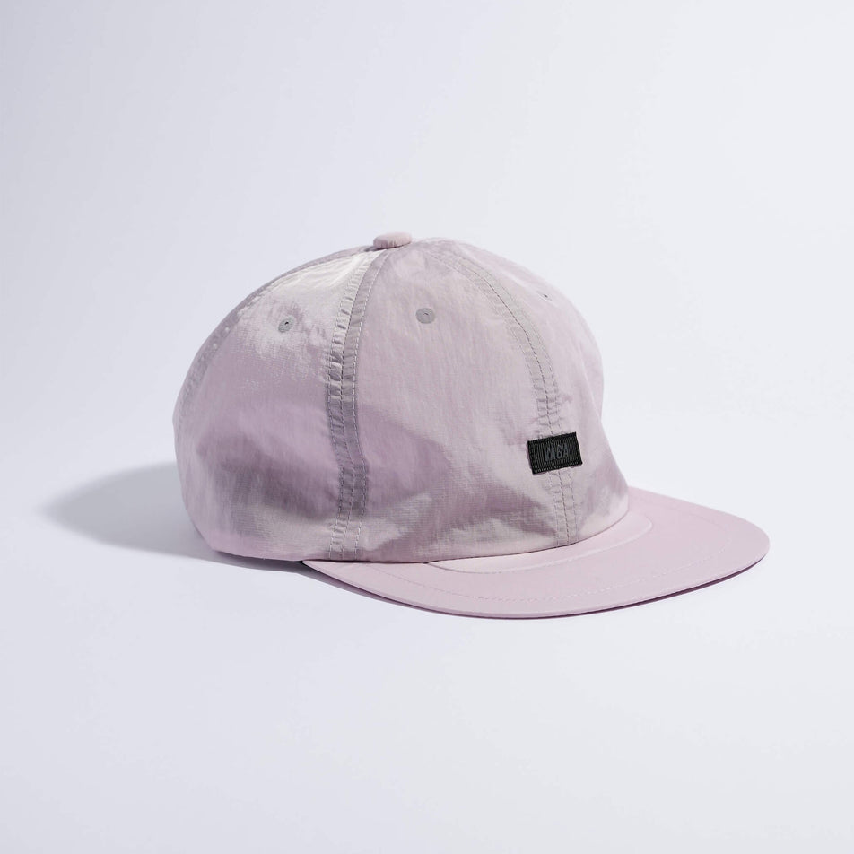 Angled view of the VAGA Unisex Drift Cap Dusty in the Lilac colourway.