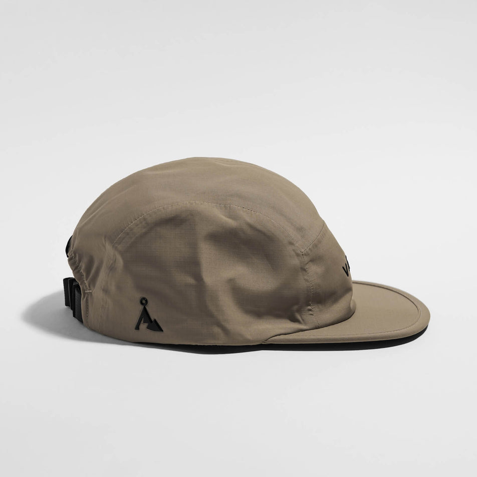 Side view of the VAGA Fell Running Cap 2.0 in the Sand colourway.