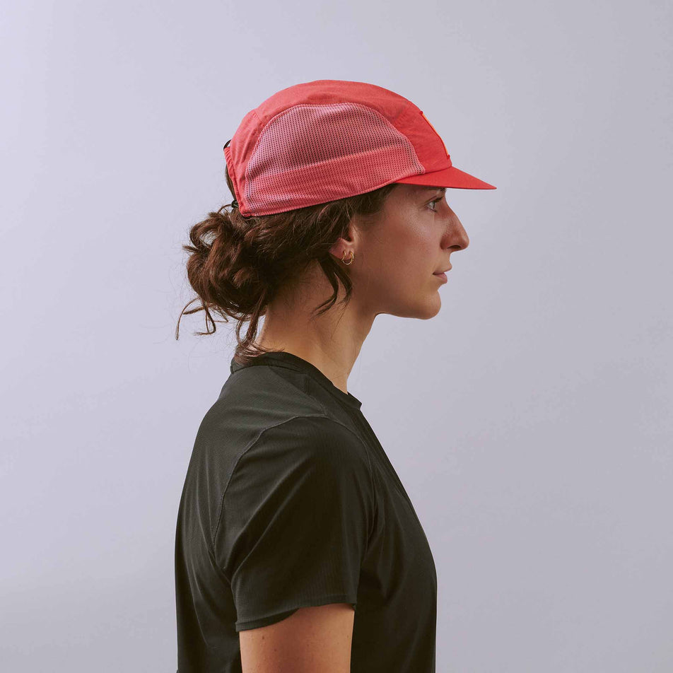 Side view of a model wearing the VÅGA Unisex Mesh Flex Cap in the Dark Pink/Pink colourway.