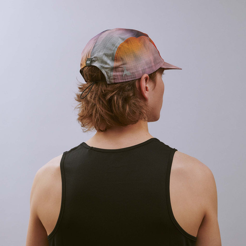 Back view of a model wearing the VÅGA Unisex Night Club Cap 2.0 in the Sunset colourway.