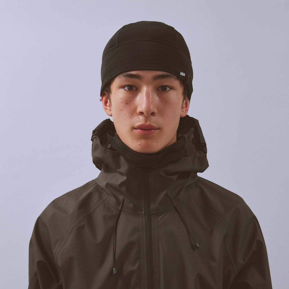 Front view of a model wearing the VAGA Unisex Summit Performance Skull Cap in the Black colourway.