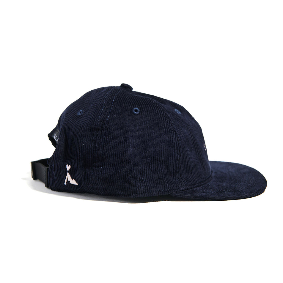Side view of the VAGA Unisex Corduroy Cap in the Navy Blue colourway. (8751577694370)