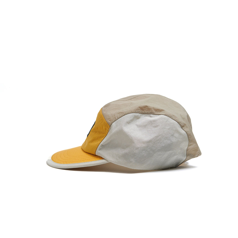 Left-hand side of a VAGA Unisex Pacer Cap in the Burnt Yellow/Taupe colourway. (8596344864930)