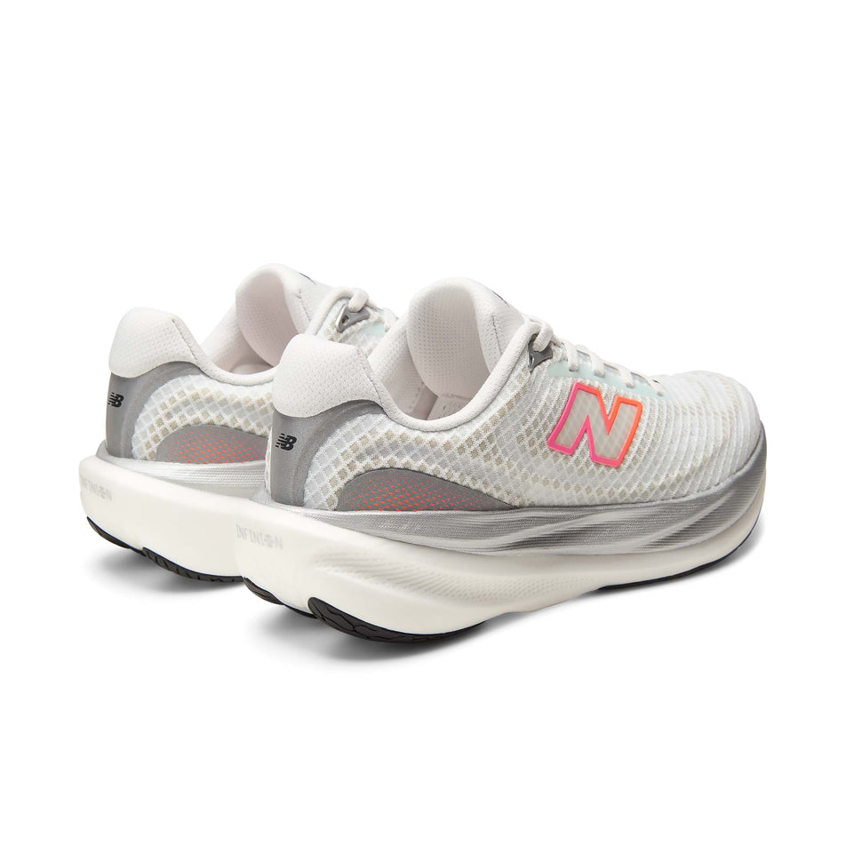 A pair of New Balance Women's 1080 V15 Running Shoes in the White/Pink Heat colourway.