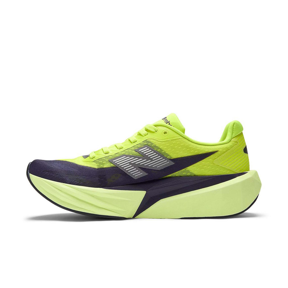 Medial view of the right shoe from a pair of New Balance Women's Fuelcell Rebel V5 Running Shoes in the Alkaline Green/Boysenberry colourway.