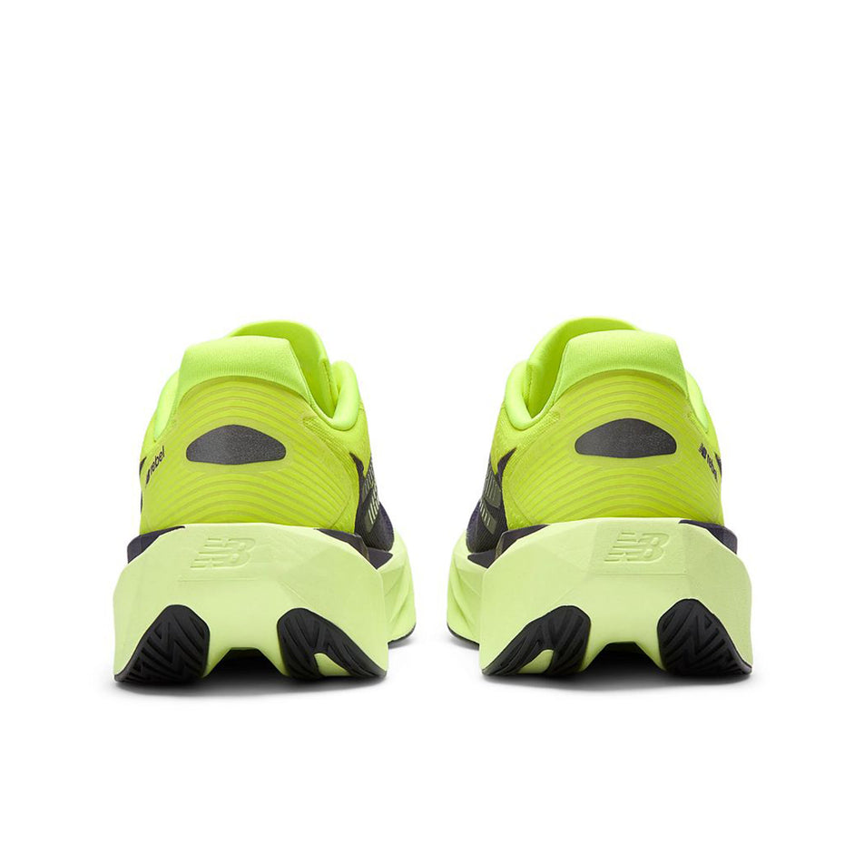 The back of a pair of New Balance Women's Fuelcell Rebel V5 Running Shoes in the Alkaline Green/Boysenberry colourway.