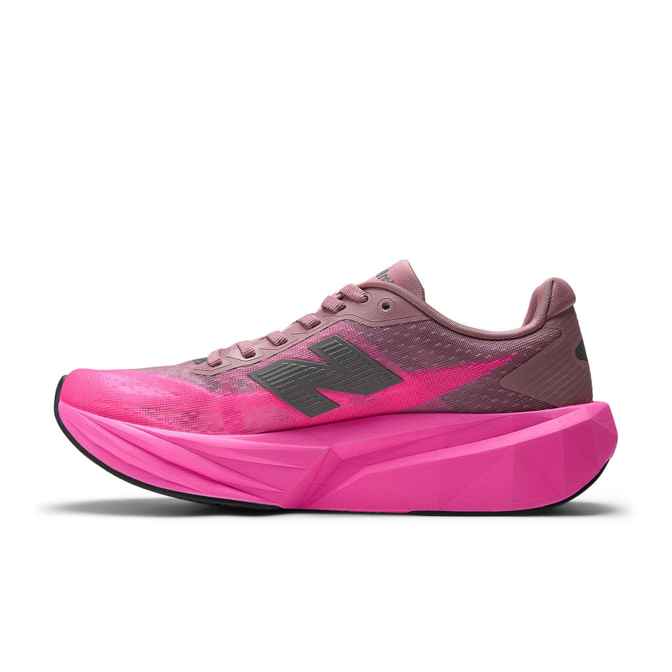 Medial view of the right shoe from a pair of New Balance Women's Fuelcell Rebel V5 Running Shoes in the Pink Heat/Rosewood colourway.