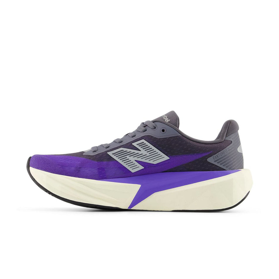 Medial view of the right shoe from a pair of New Balance Women's Fuelcell Rebel V5 Running Shoes in the Electric Indigo/Truffle Salt colourway.