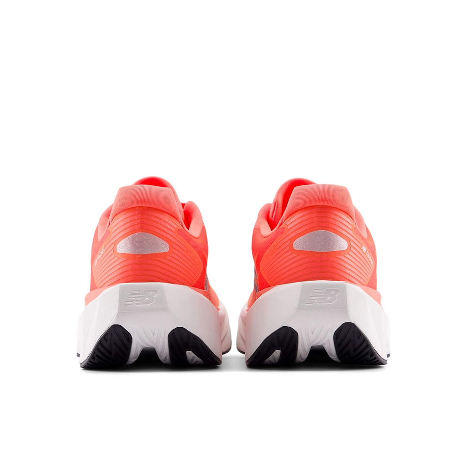 The back of a pair of New Balance Women's FuelCell Rebel v5 Running Shoes in the Urgent Red colourway. (8712249475234)