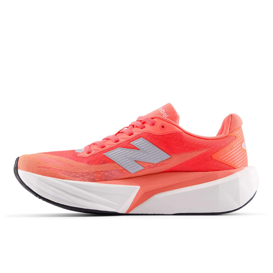 Medial view of the right shoe from a pair of New Balance Women's FuelCell Rebel v5 Running Shoes in the Urgent Red colourway. (8712249475234)