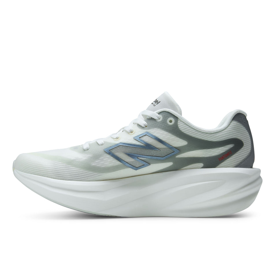 Medial view of the right shoe from a pair of New Balance Women's SC Rebel Running Shoes in the Sea Salt/Neo Flame colourway.