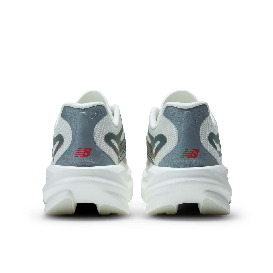 The back of a pair of New Balance Women's SC Rebel Running Shoes in the Sea Salt/Neo Flame colourway.