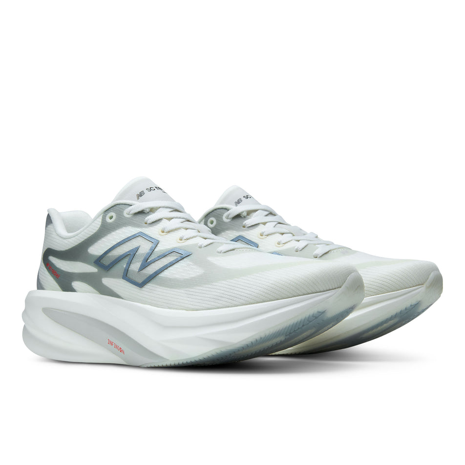 A pair of New Balance Women's SC Rebel Running Shoes in the Sea Salt/Neo Flame colourway.