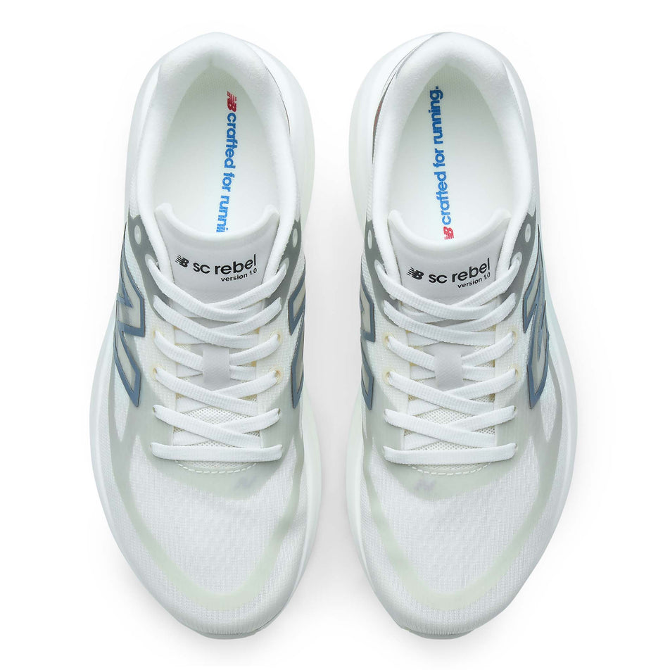 The uppers of a pair of New Balance Women's SC Rebel Running Shoes in the Sea Salt/Neo Flame colourway.