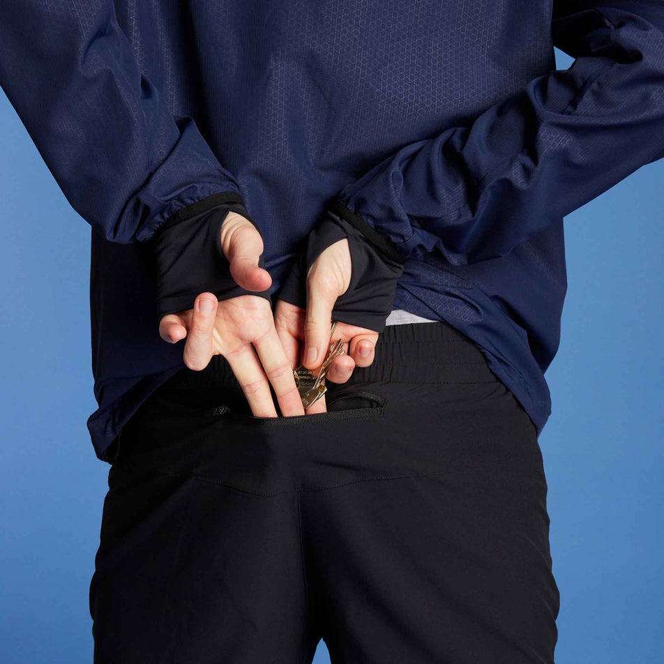 A model demonstrating that keys can be stored in the zipped back pocket of the SAYSKY Unisex Pace Pants. Model is also wearing a top. (8602035814562)