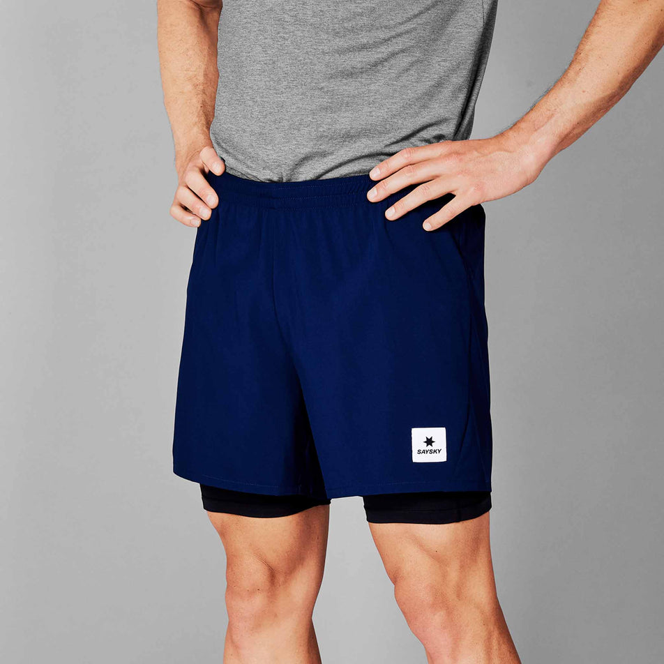 Front view of a model wearing the SAYSKY Men's 2 in 1 Pace Shorts 5