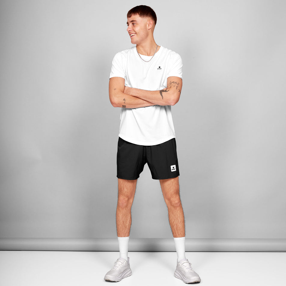 Front view of a model wearing the SAYSKY Men's Clean Combat Pro T-Shirt in the White colourway. Model is also wearing shorts, socks and shoes. (8602103316642)