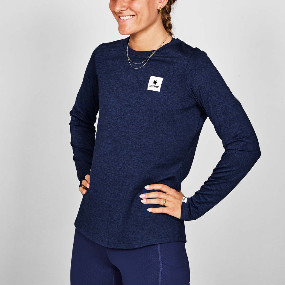 Front view of a model wearing the SAYSKY Women's Clean Pace Long Sleeve in the Blue colourway. (8731654062242)