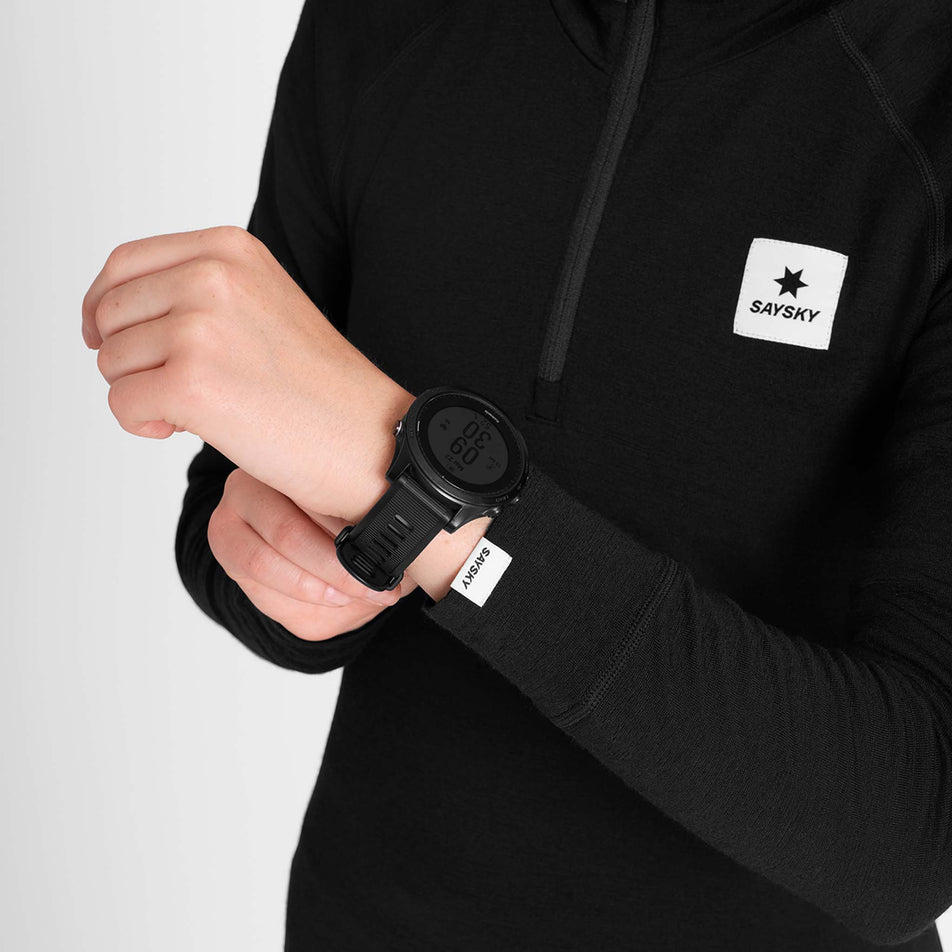 Close-up view sleeve of the SAYSKY Women's Merino 165 Base 1/2 Zip Long Sleeve in the Black colourway.