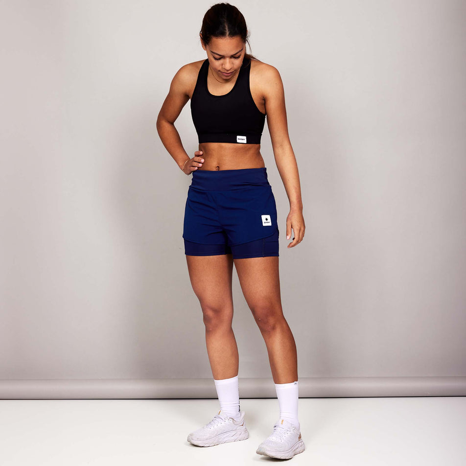 Front view of a model wearing the SAYSKY Women's 2 In 1 Pace Shorts 3