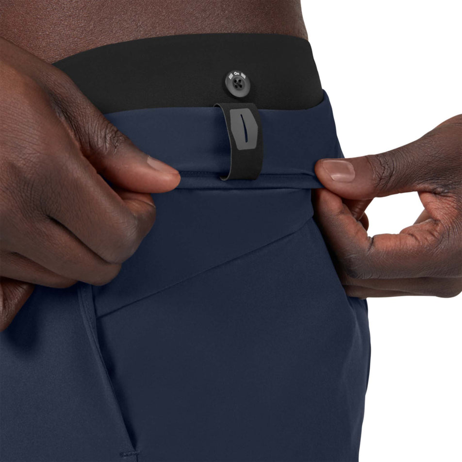 Button view of men's on hybrid shorts in blue (7489120764066)