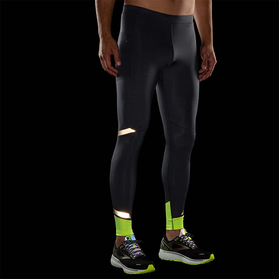 Front reflective view of Brooks Men's Run Visible Tight in black (7599112880290)