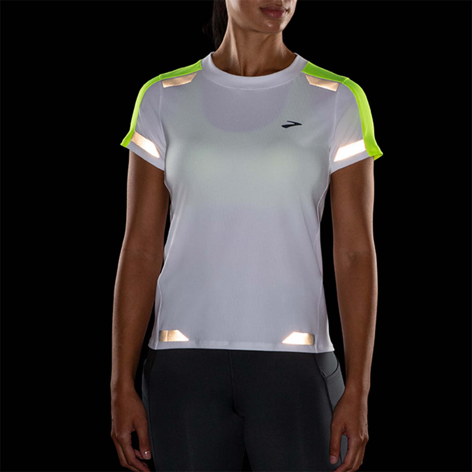 Front reflective view of Brooks Women's Run Visible Short Sleeve in white (7599100985506)