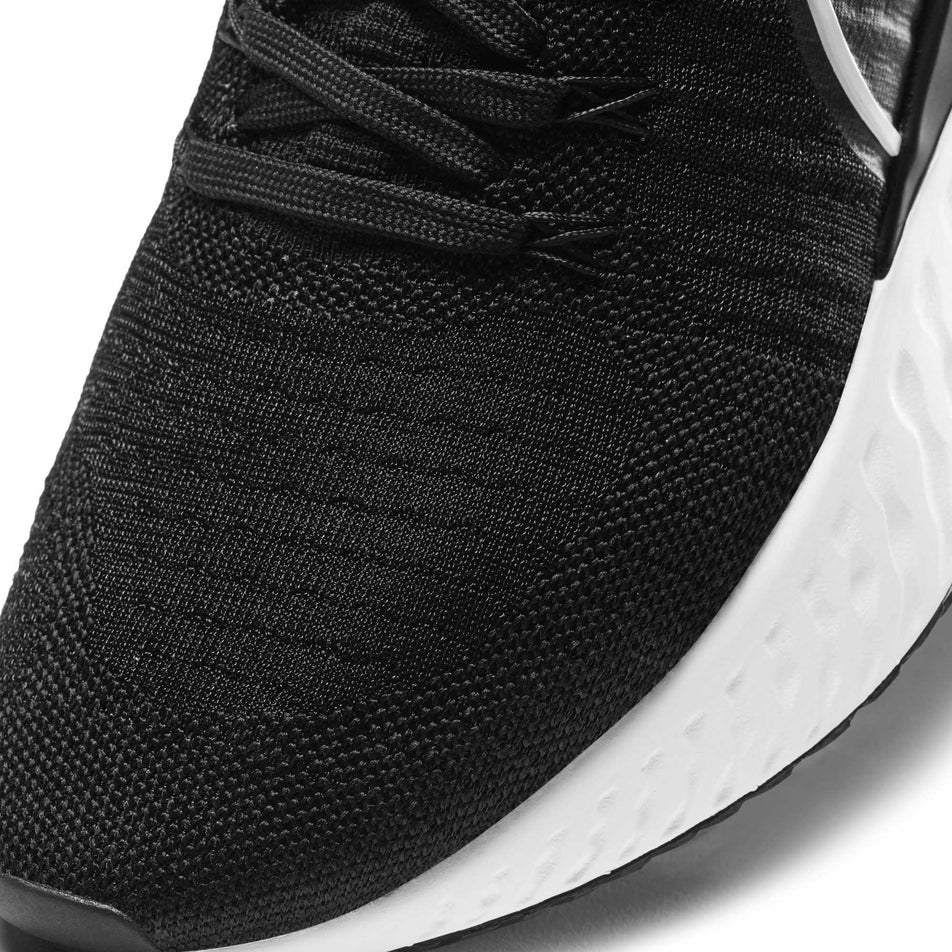 Toe box of the left shoe from a pair of men's Nike React Infinity Run Flyknit 2 (6899248038050)