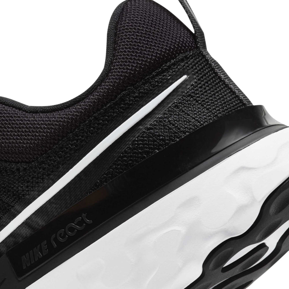 Rear area of the left shoe from a pair of women's Nike React Infinity Run Flyknit 2 (6899373539490)