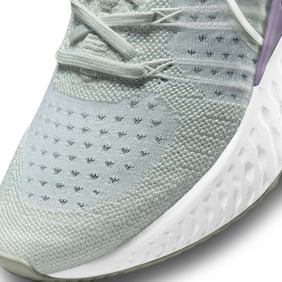 The forefoot upper on the left shoe from a pair of women's Nike React Infinity Run Flyknit 2 (6899757285538)