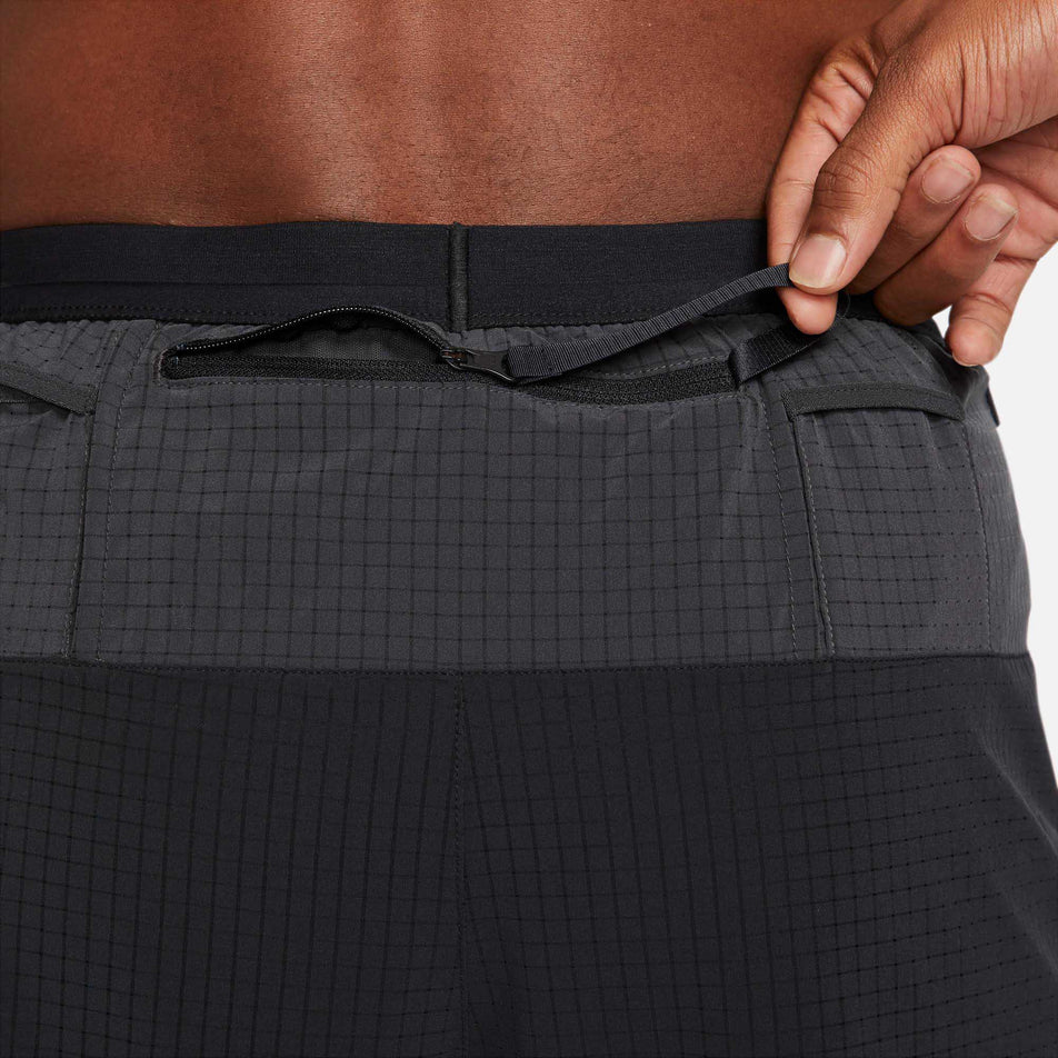 Back zip pocket view of men's nike dri-fit trail flex stride short 5 inch (6918066995362)