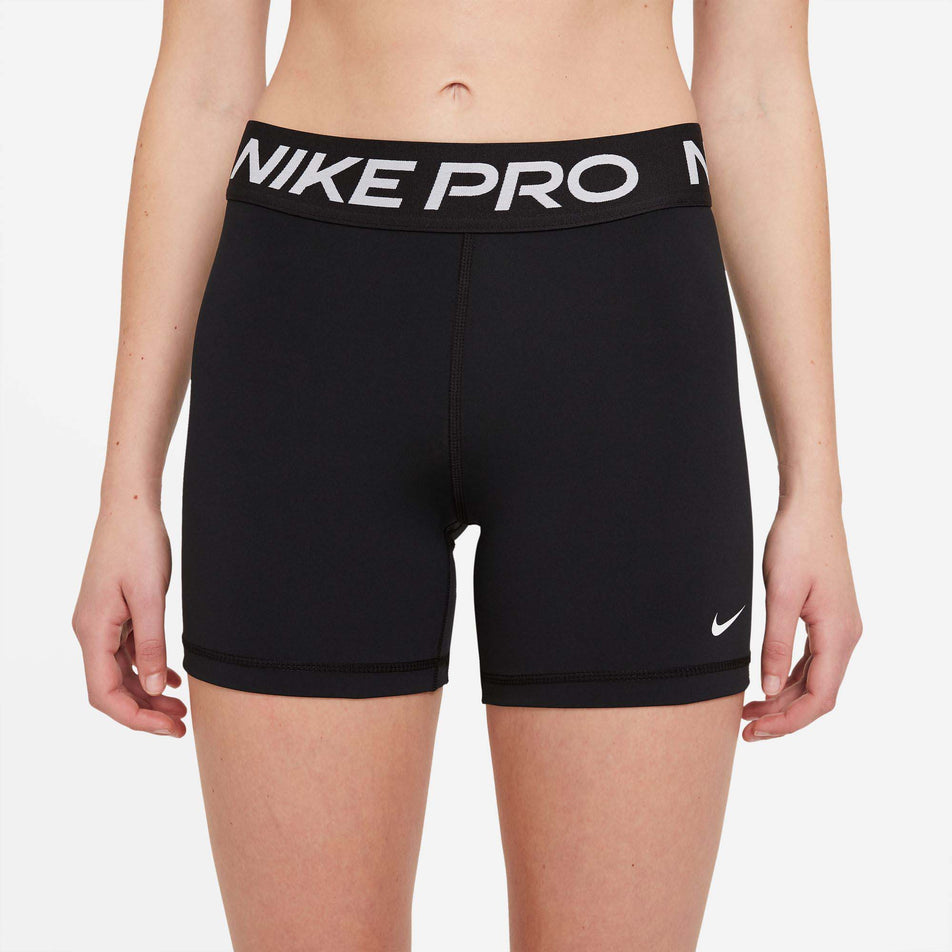 Front view of Nike Women's NP 365 Short 5 Inch in black. (7729545478306)