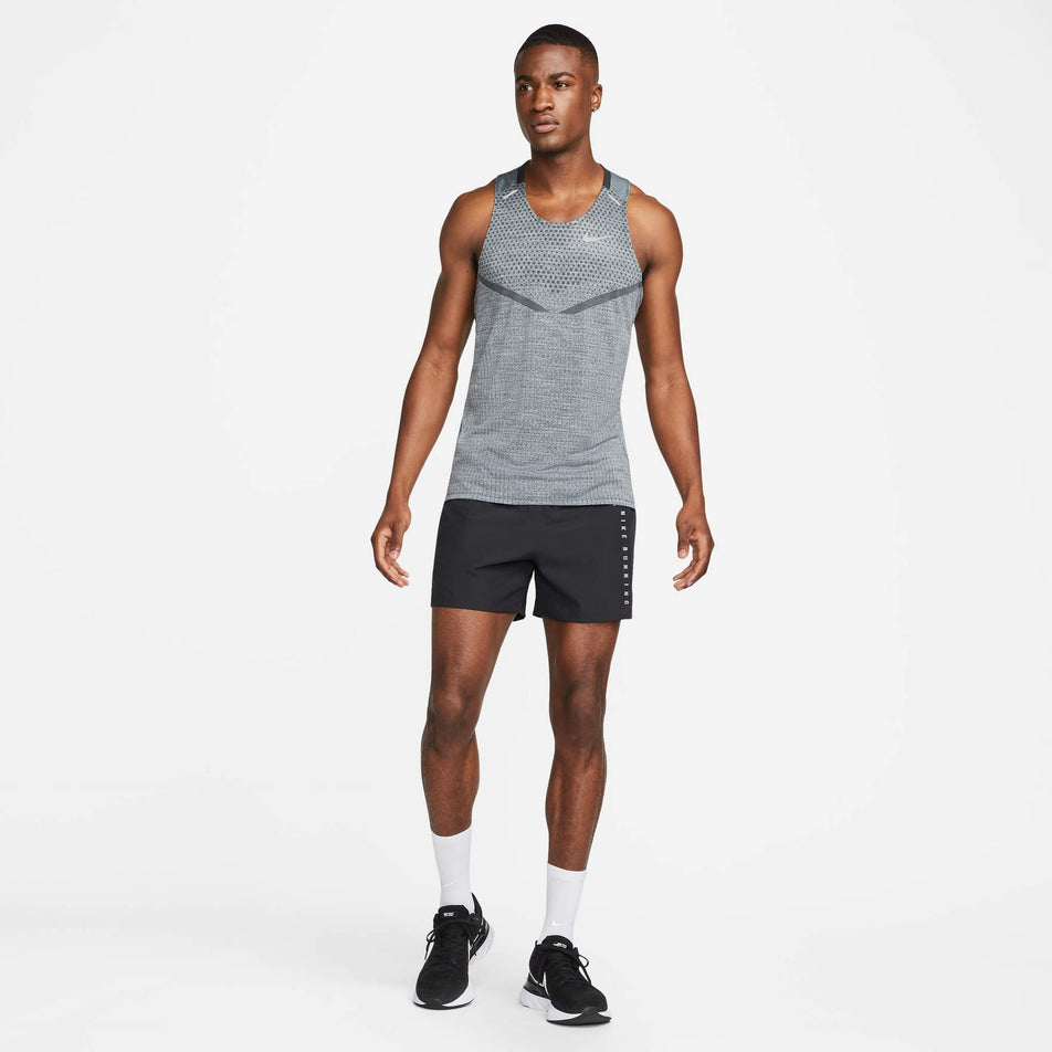 Front view of a model wearing a Nike Men's Dri-FIT ADV Techknit Ultra Running Tank (7876647288994)