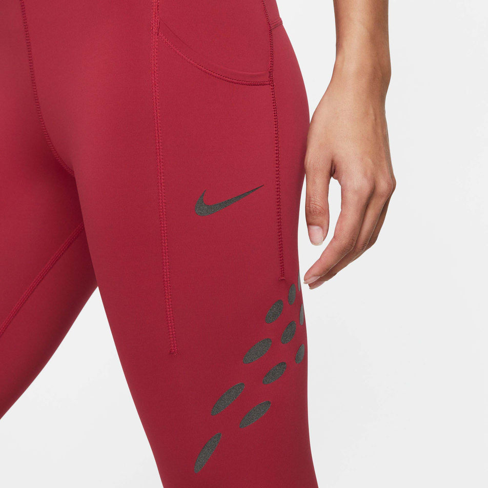 Side pouch view of women's nike df run dvn mr tight (7385210814626)