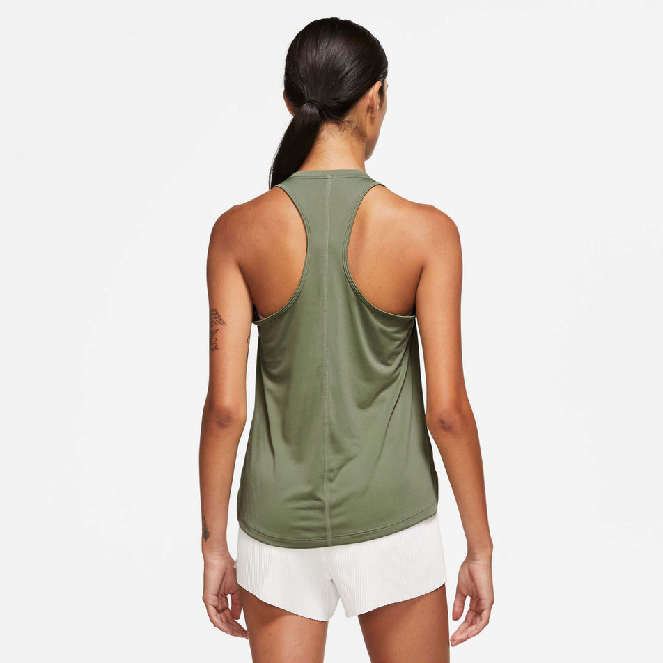 Back view of a model wearing a Nike Women's Dri-FIT One Swoosh Tank Top (7876364435618)