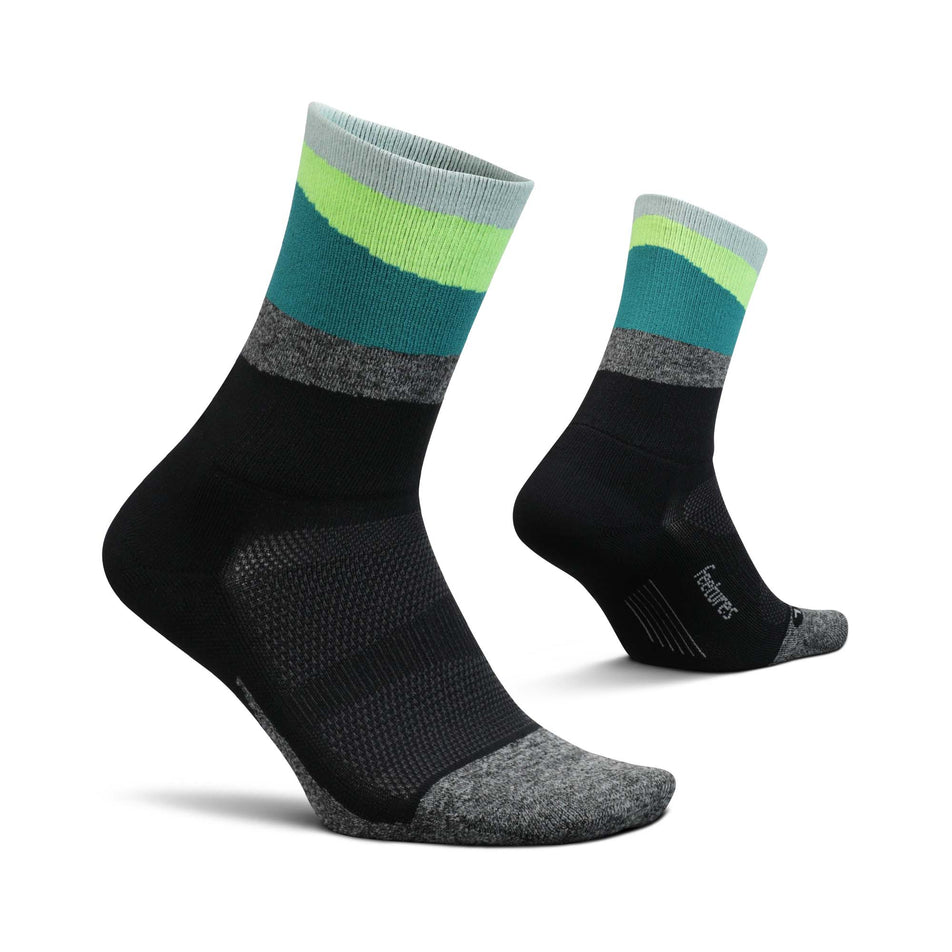 A pair of Feetures Unisex Elite Light Cushion Mini Crew Running Socks in green. (7757397164194)