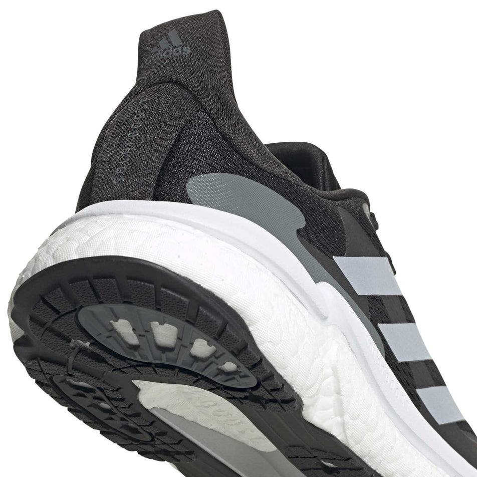 The heel unit on the right shoe from a pair of men's adidas Solar Boost 3 (6893369131170)