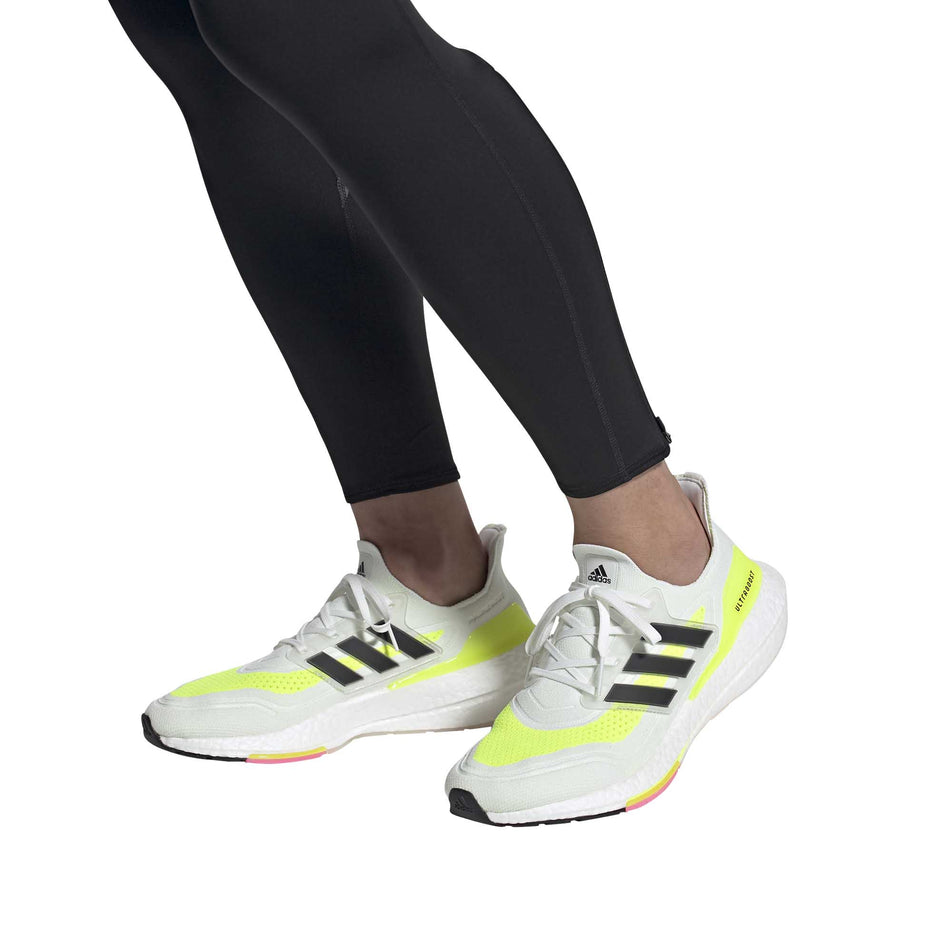A model wearing a pair of men's adidas Ultraboost 21 (6893318766754)