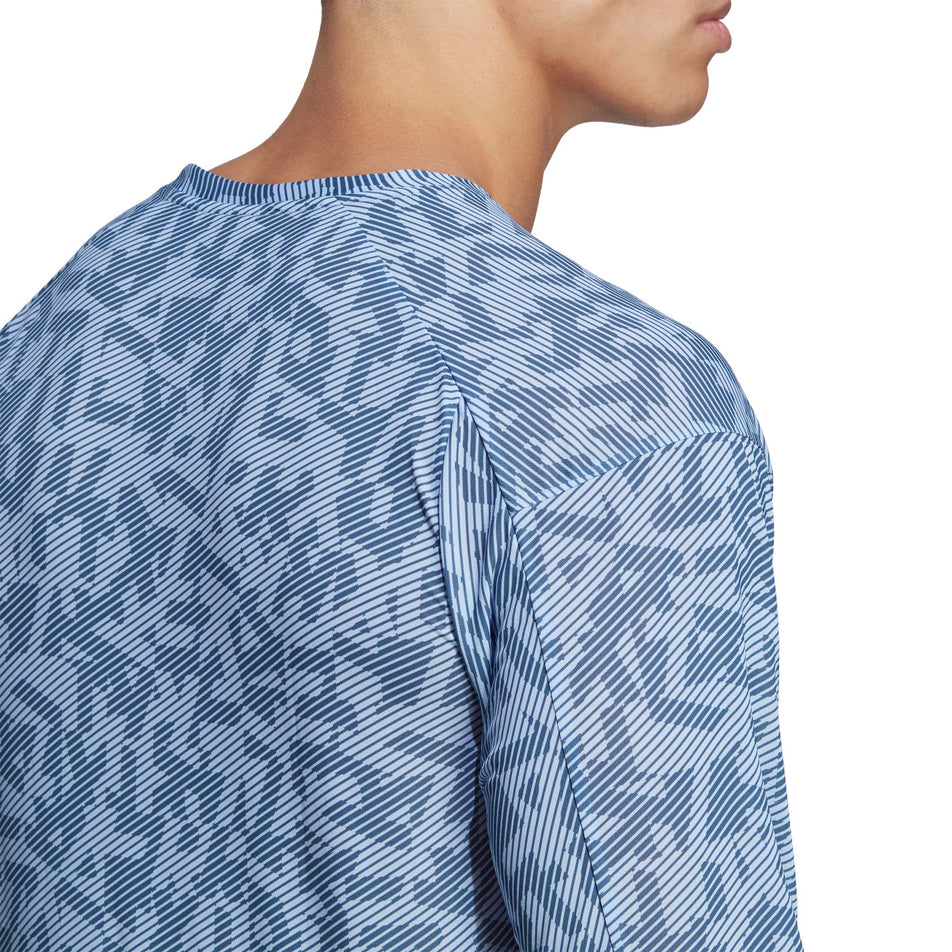 Close-up back view of a model wearing an adidas Men's Terrex Primeblue Trail Graphic Longsleeve (7766877962402)