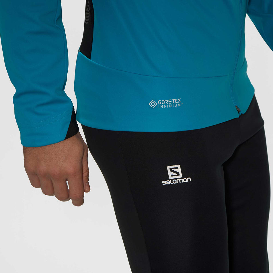 Reflective waist detail of Salomon GORE-TEX INFINIUM™ WINDSTOPPER® Pro Jacket (6918194495650)