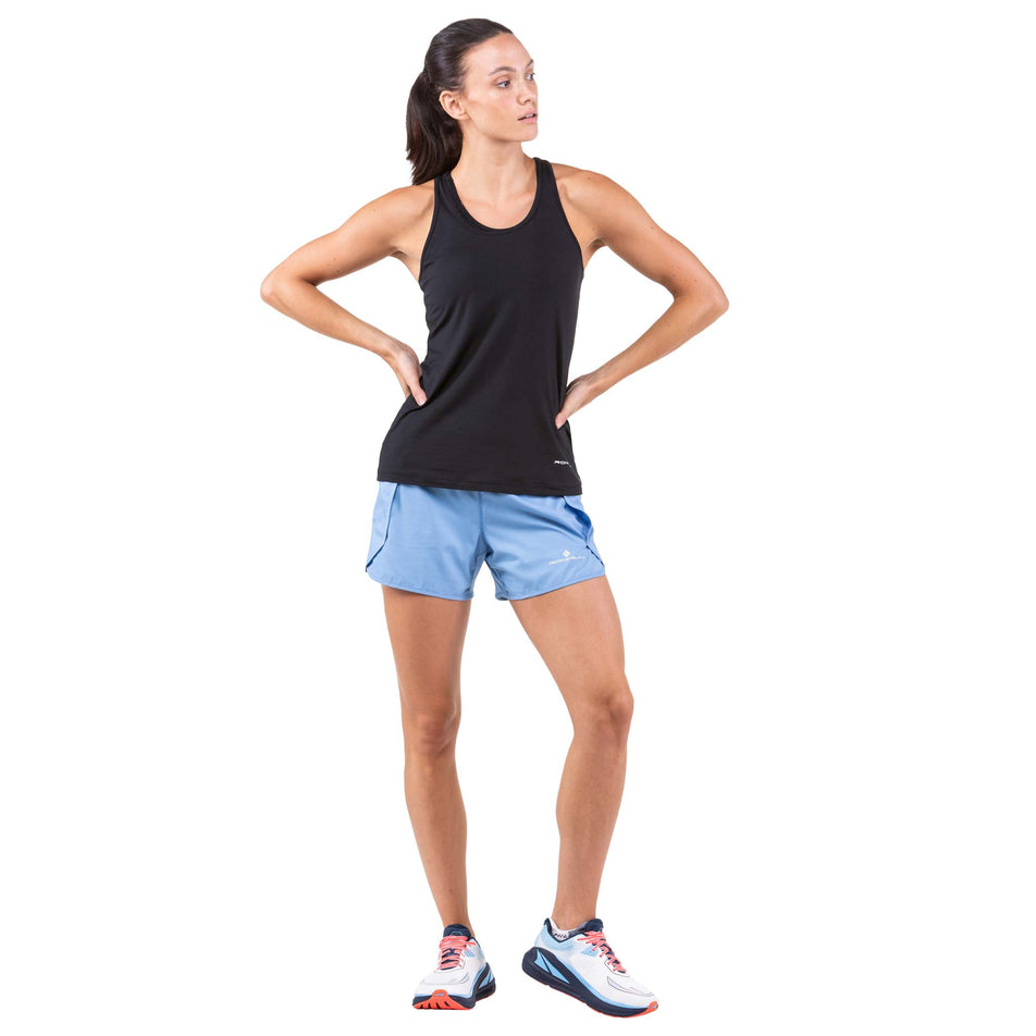 Front view of a model wearing a pair of Ronhill Women's Tech Revive Shorts in the Lake Blue/Vanilla colourway (7739495776418)