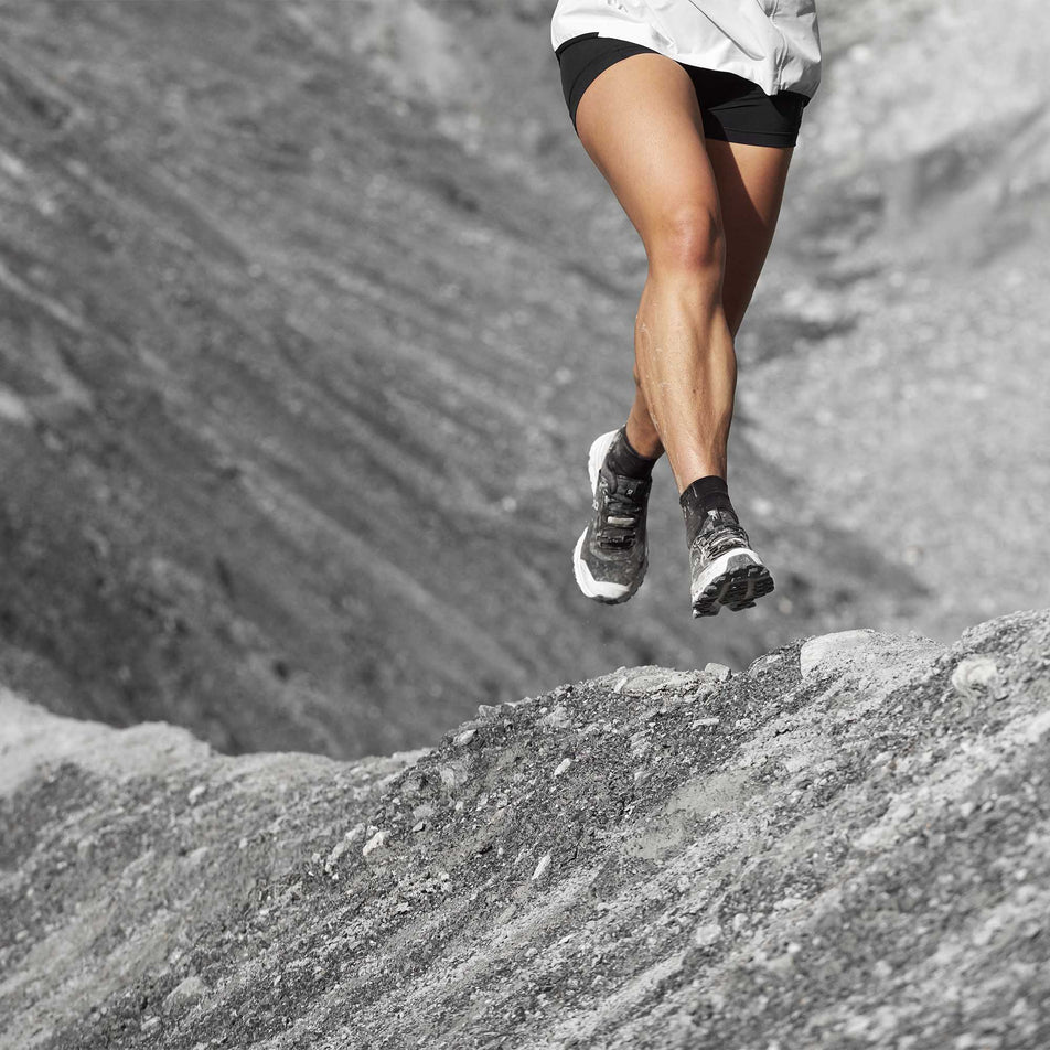 Person running outdoors wearing a pair of On Cloudultra running shoes (6888586412194)