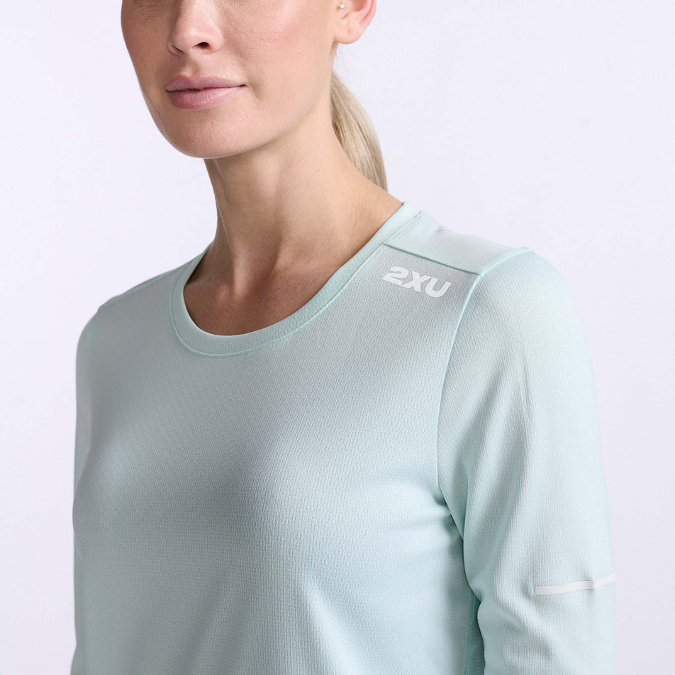 Close-up front view of the upper body section of a 2XU Women's Aero L/S running top, being worn by a model (7778518958242)