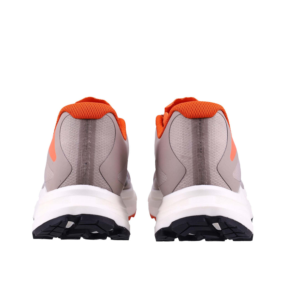 The back of a pair of INOV8 Women's TrailFly Pro Running Shoes in the Light Brown/Orange colourway.
