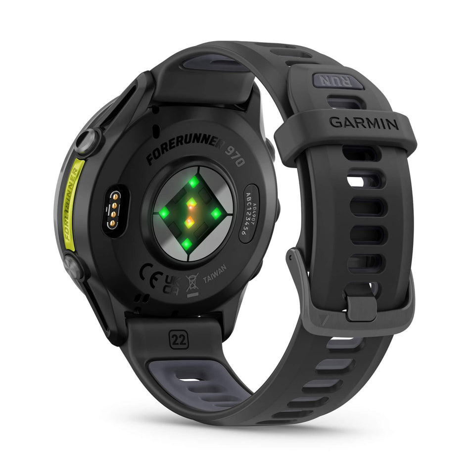 A Garmin Forerunner 970. Carbon Grey DLC Titanium with Black Case and Black/Translucent Whitestone Band. Back of watch and wrist-based heart rate monitor. (8692398031010)